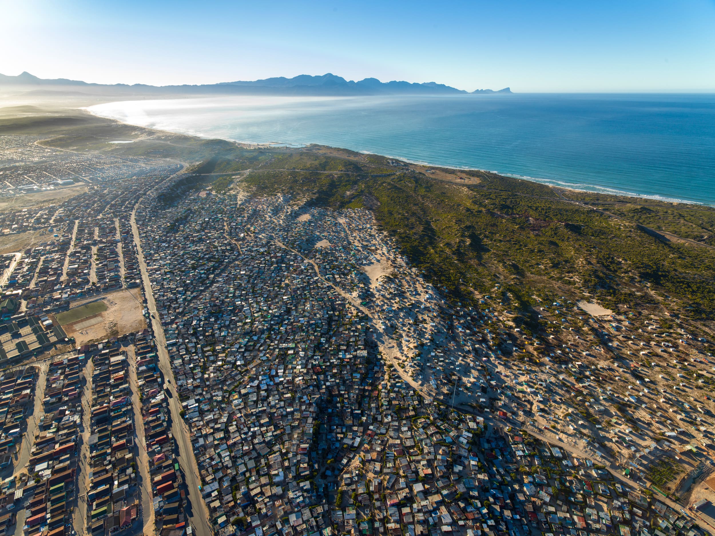 The Cape Flats townships meeting the sea, from the air